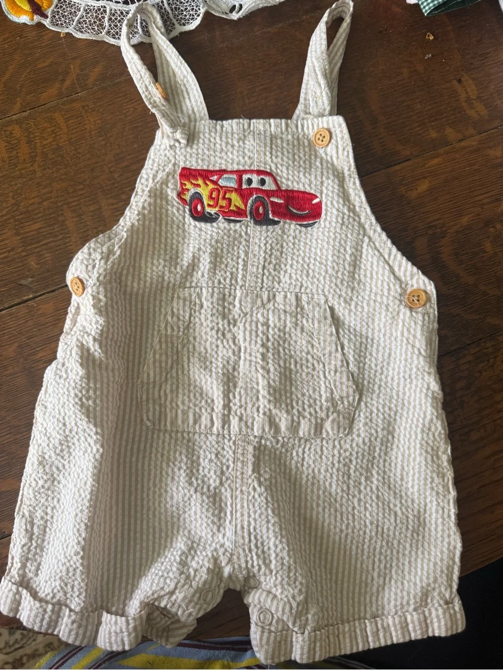 Disney Cream Seersucker Overalls with Red Lightning McQueen Patch